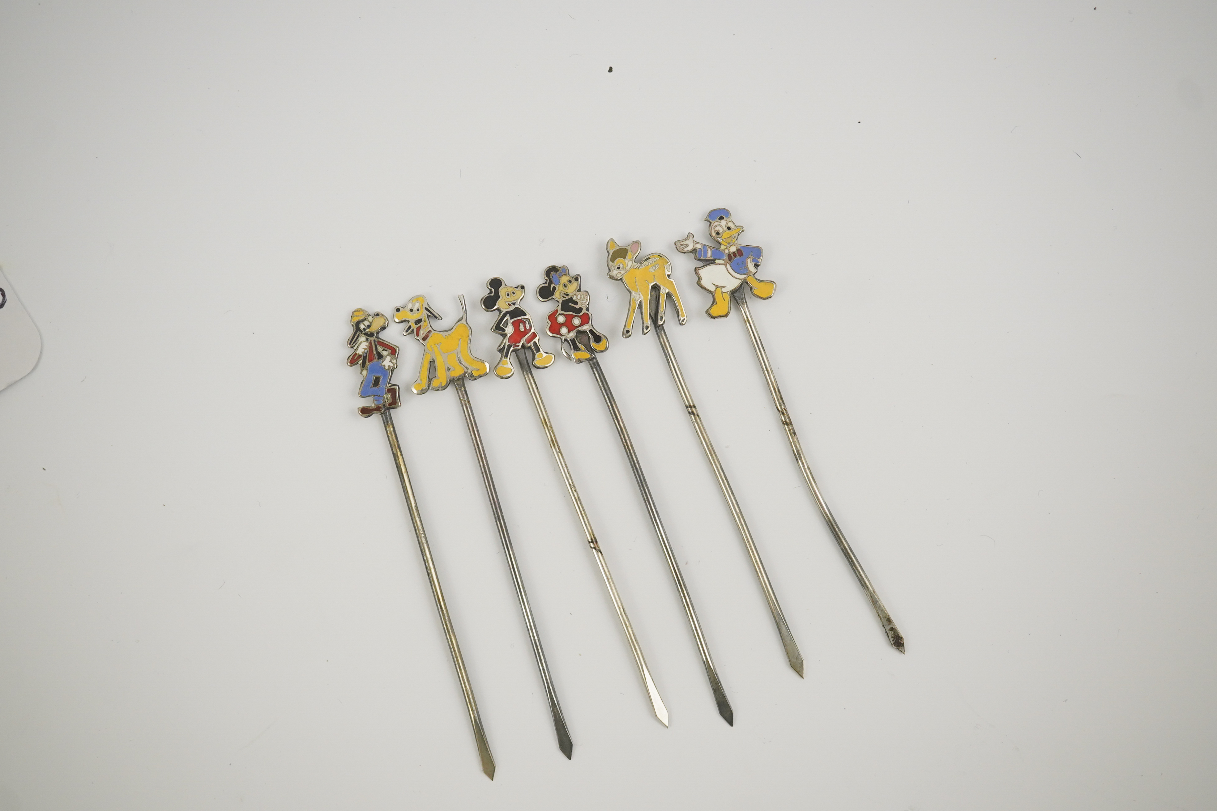 A cased set of six enamelled sterling Disney Character cocktail sticks